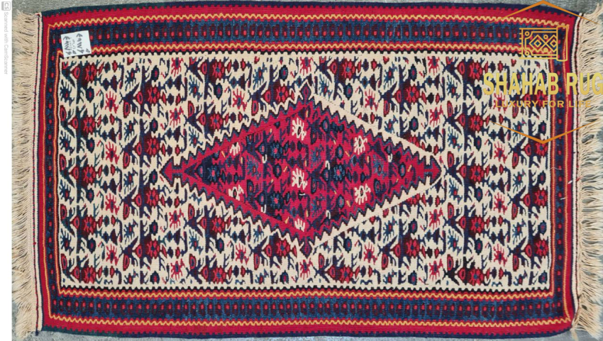 A vibrant,handwoven Sanandaj kilim with traditional Kurdish geometric patterns