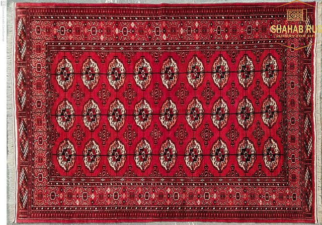 Traditional red Yamut rug with geometric medallions from Iran