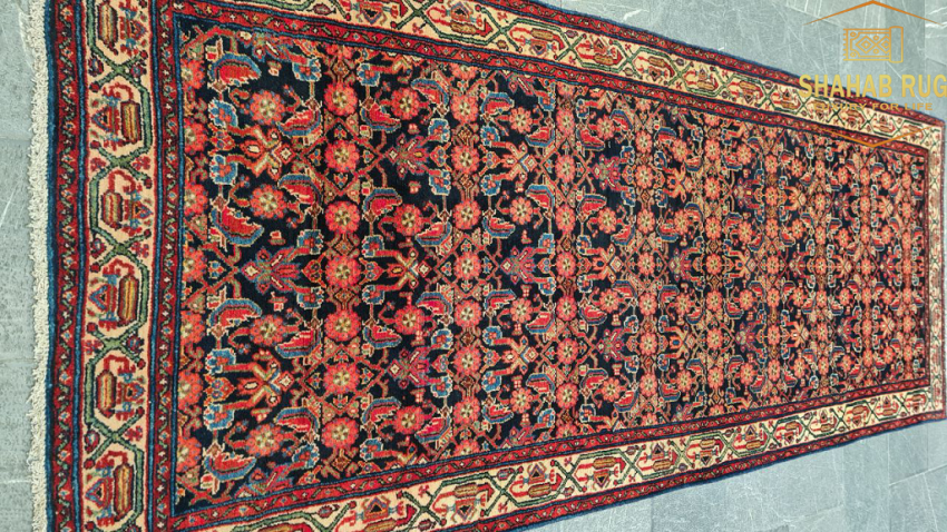 Handwoven Saveh runner with geometric patterns and natural earthy tones from Saveh City, Iran.